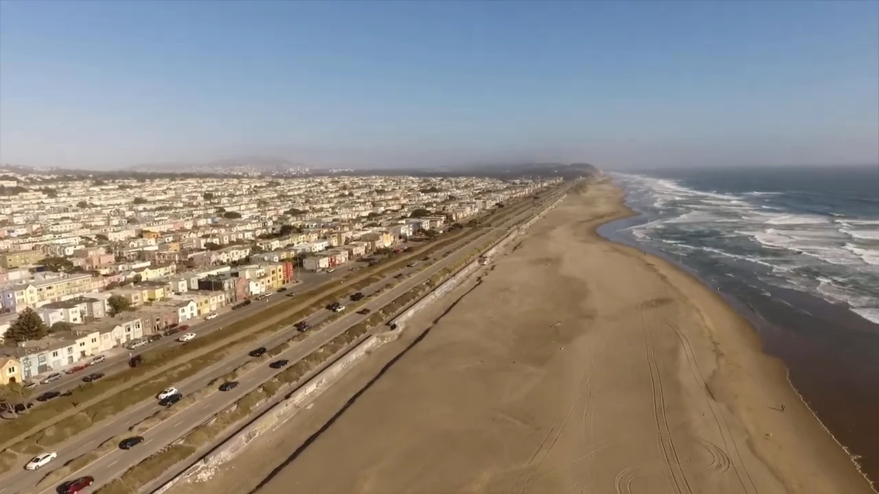 An aerial view along the coast and nearby neighborhood