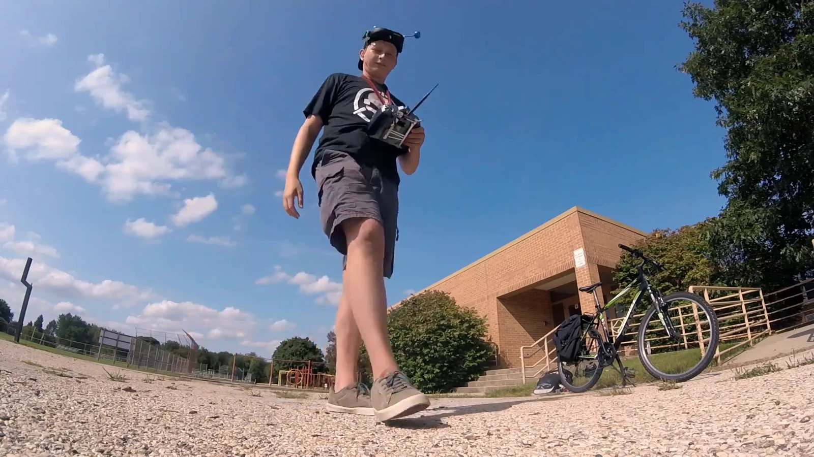 Nicholas outdoors with a radio transmitter