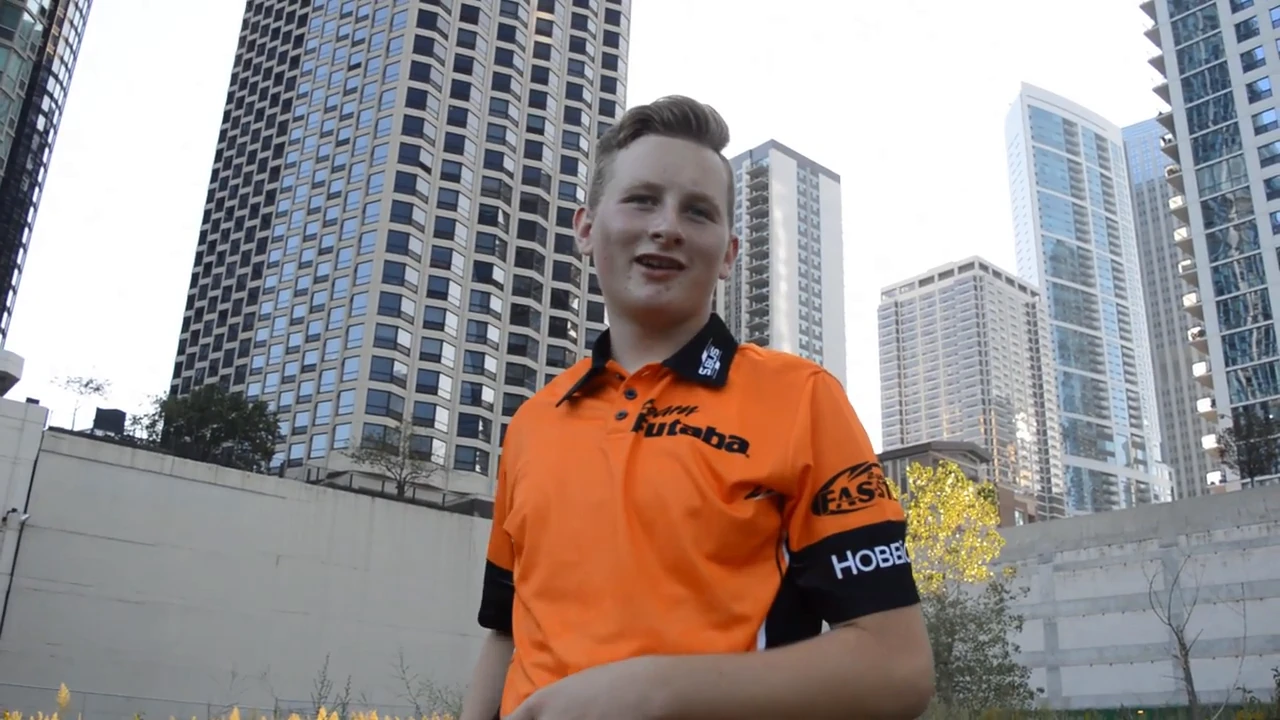 Nicholas outdoors against a city skyline