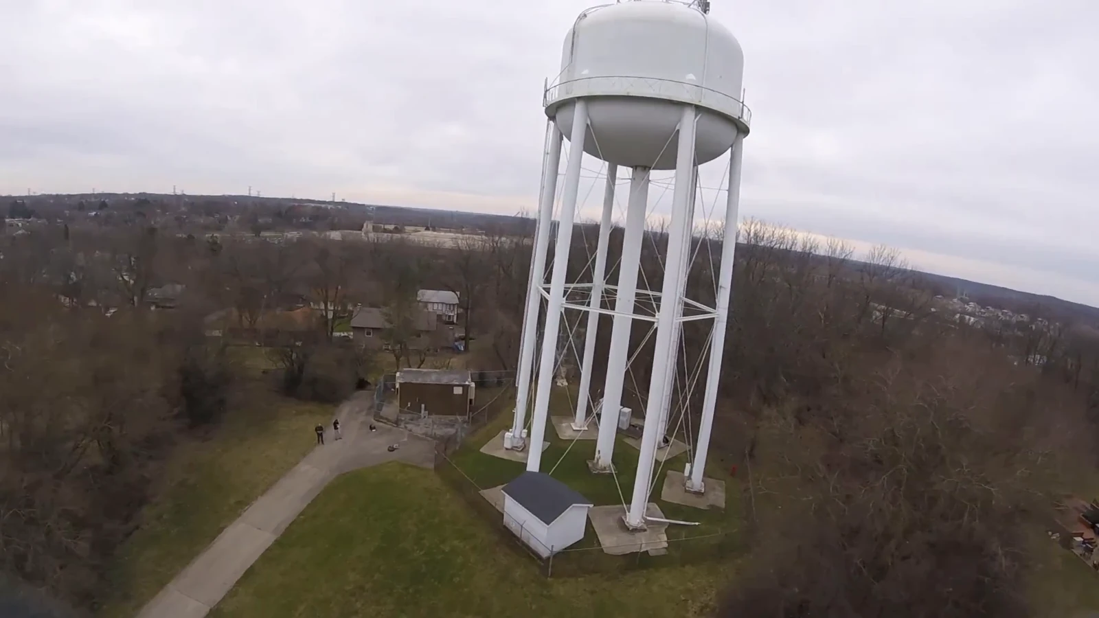 An aerial view of a water tower and surrounding landscape