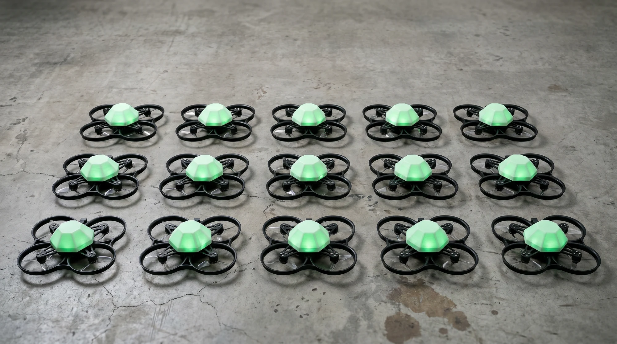 Fifteen green-lit Parallax Arena drones arranged as an entry-level kit